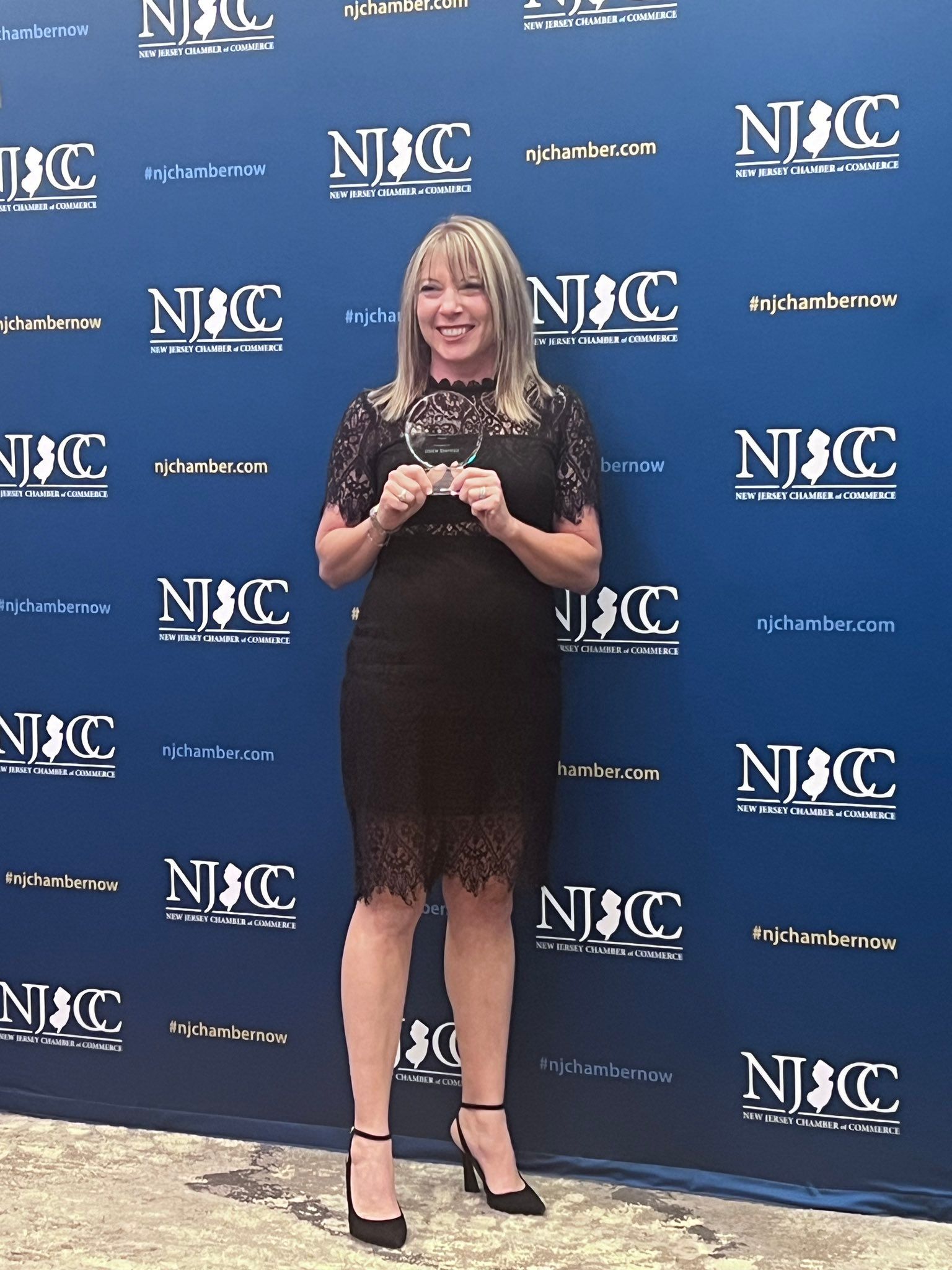 Stacie accepting her award from the NJ Chamber